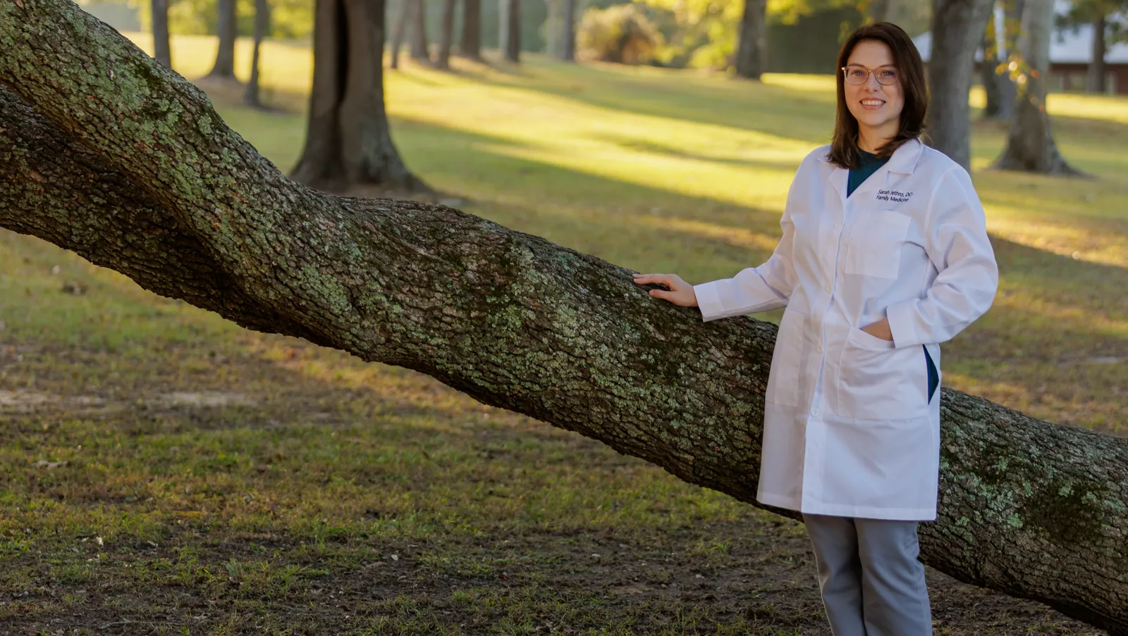 Portrait of Dr. Sarah Jethro near a tree outside.